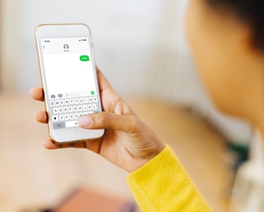 Woman using gammaCare Text Program.